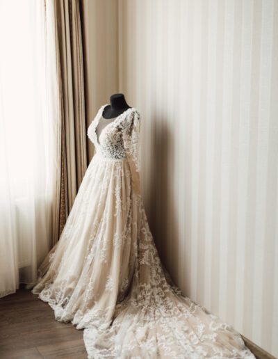 Beautiful wedding dress with plume is dressed on a mannequin