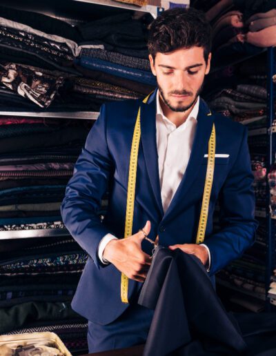 Portrait of a young male tailor working in his workshop